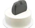 Black fondant clutch bag cake topper