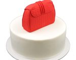 Red fondant clutch bag cake topper