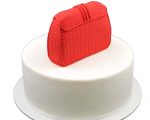 Red fondant clutch bag cake topper